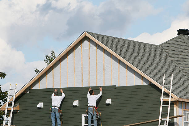 Professional Storm Damage Siding Repair technician working in Mendota, MN